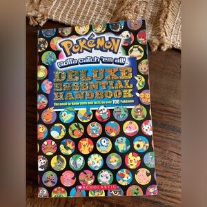 Pokémon deluxe essential handbook paperback version by scholastic